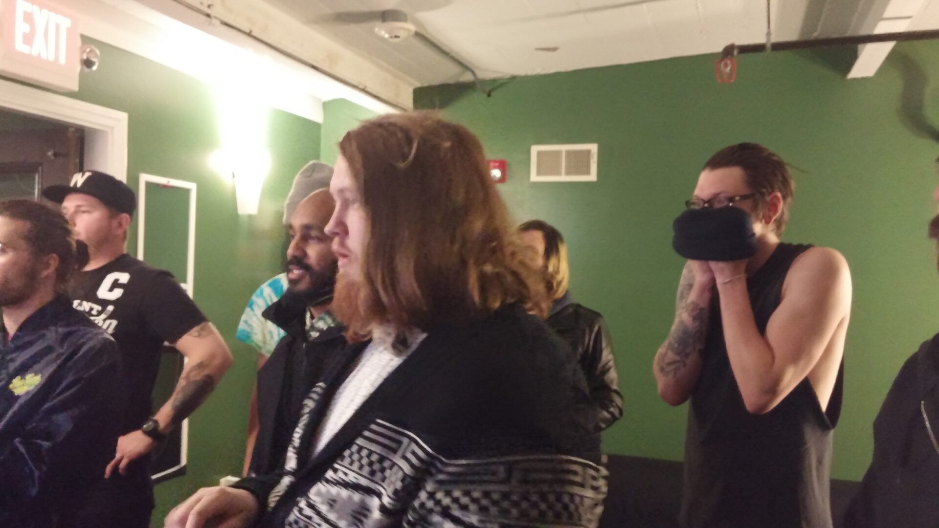 Everyone watches the TV in the green room at Brighton Music hall in Boston as Kansas University battled Oklahoma in a very tight game. Both Taylor from NSN, and Luke from Me Like Bees are avid KU fans.